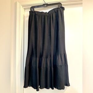 Pre owed and in excellent condition. Long skirt with pleats with belt loops.